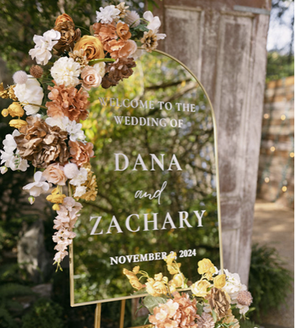 a mirror with the bride and groom's names on it