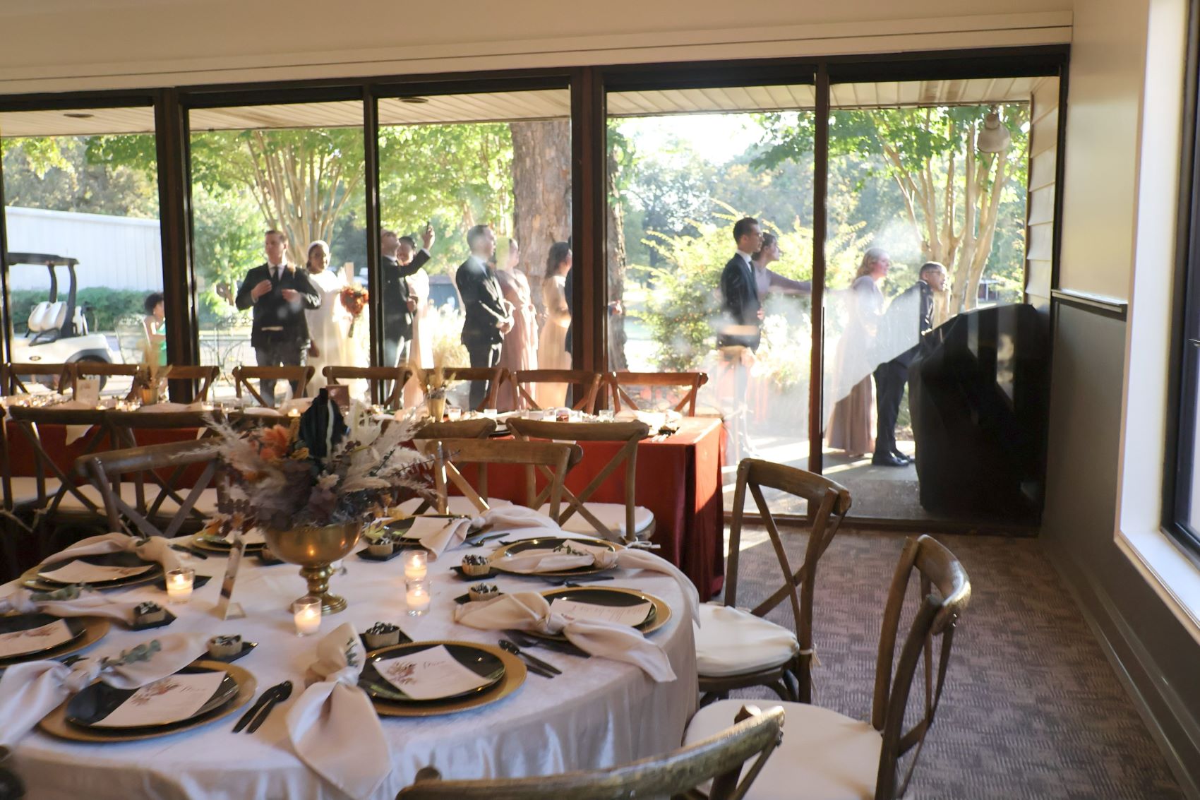 a beautiful bouquet of flowers on a dinner table at a rustic venue