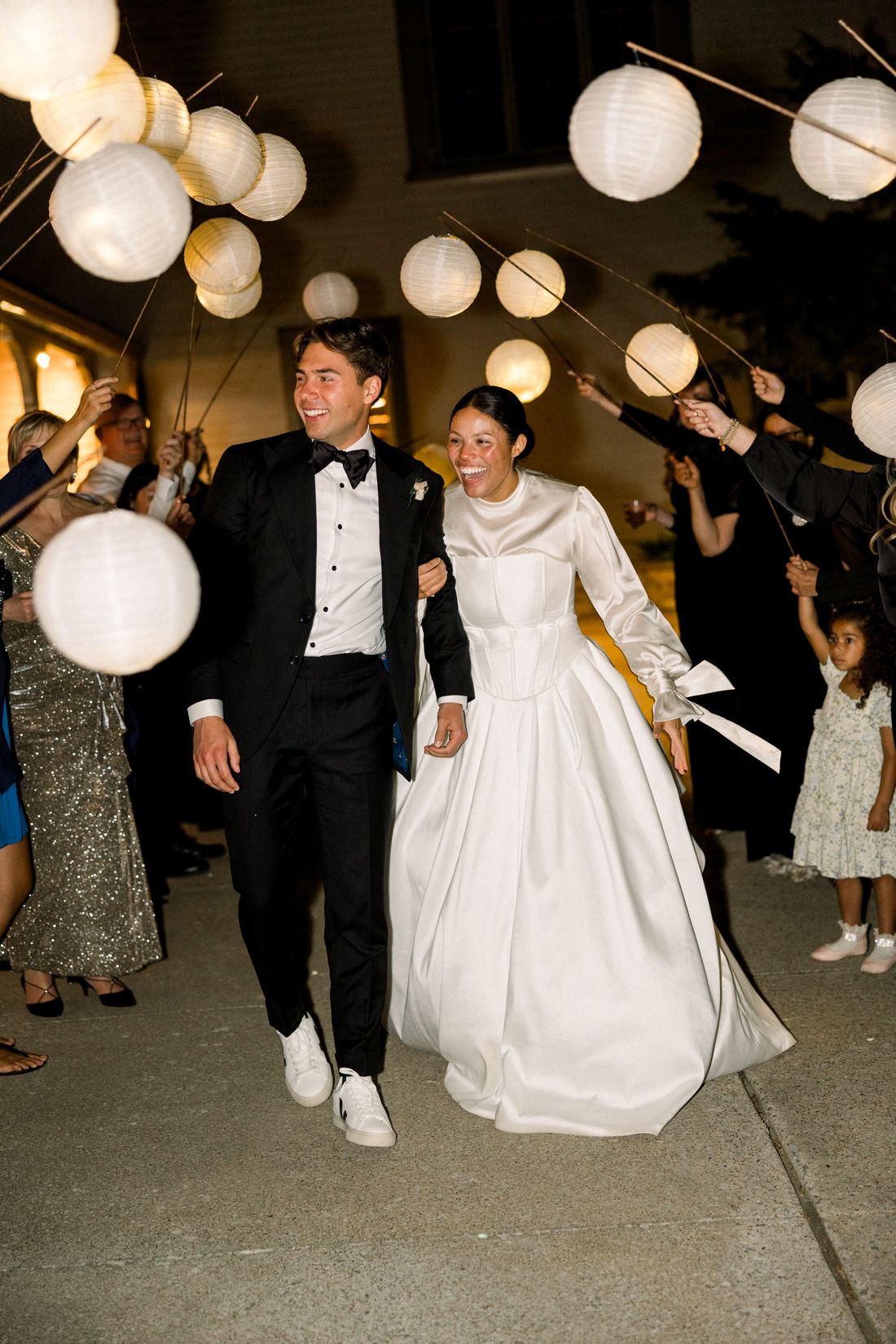 a bride and groom outside Belle Étoile Manor at dusk
