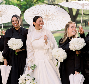 a bride and bridesmaids hold umbrellas at Belle Étoile Manor